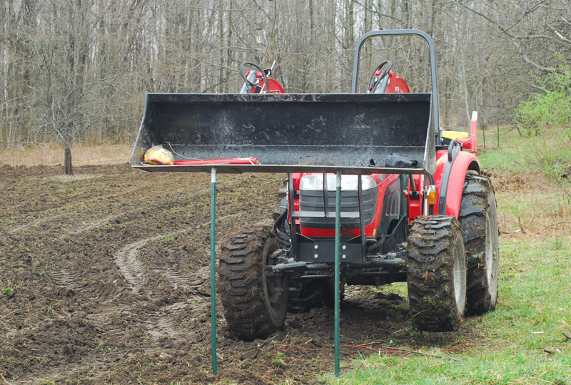 Pushing the T-Posts in with a McCormick X10.55