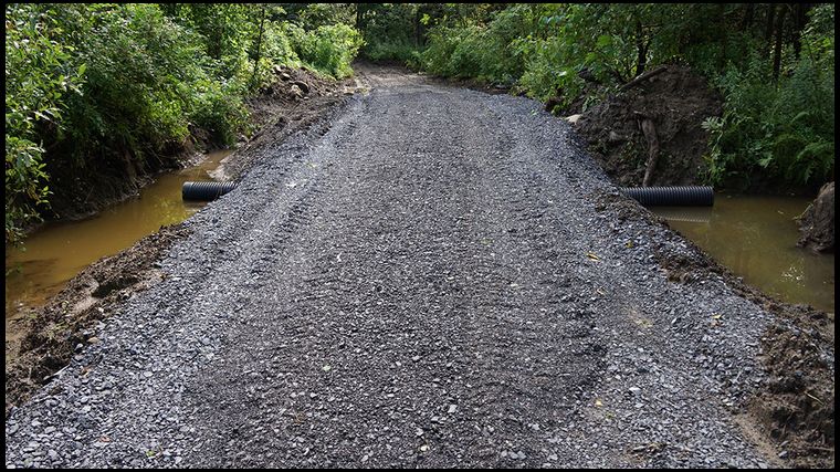 This was a big DIY job and a real test for my excavating and dozer skills. But the end result is a road that will properly drain. Finally.
